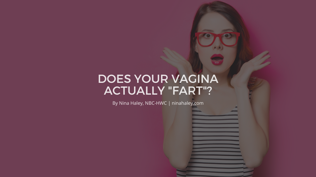 “Woman wearing red glasses standing and gasping with her hands held in surprise.”
